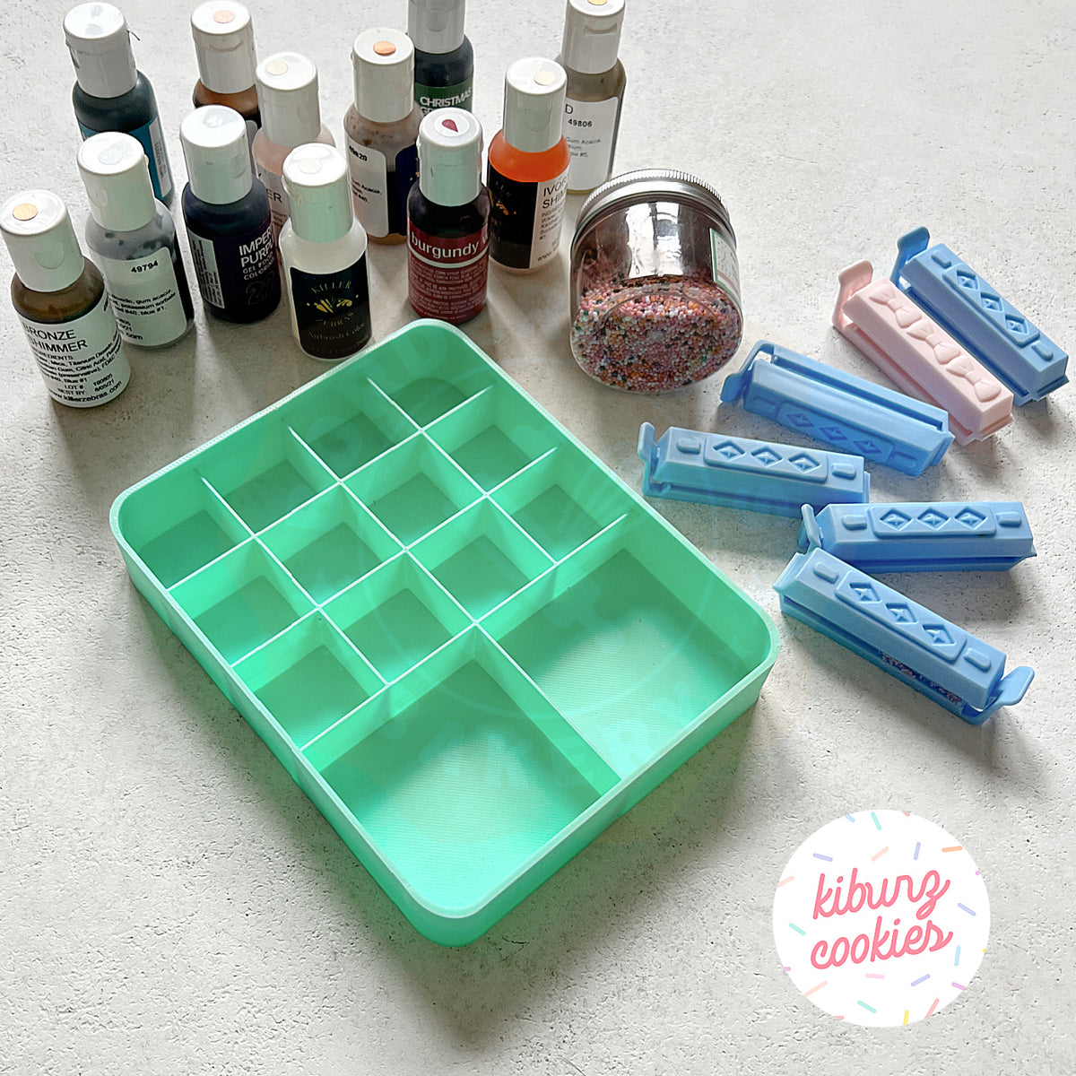 Mint green 3D printed gel color organizer with 12 wells, designed by Kiburz Cookies