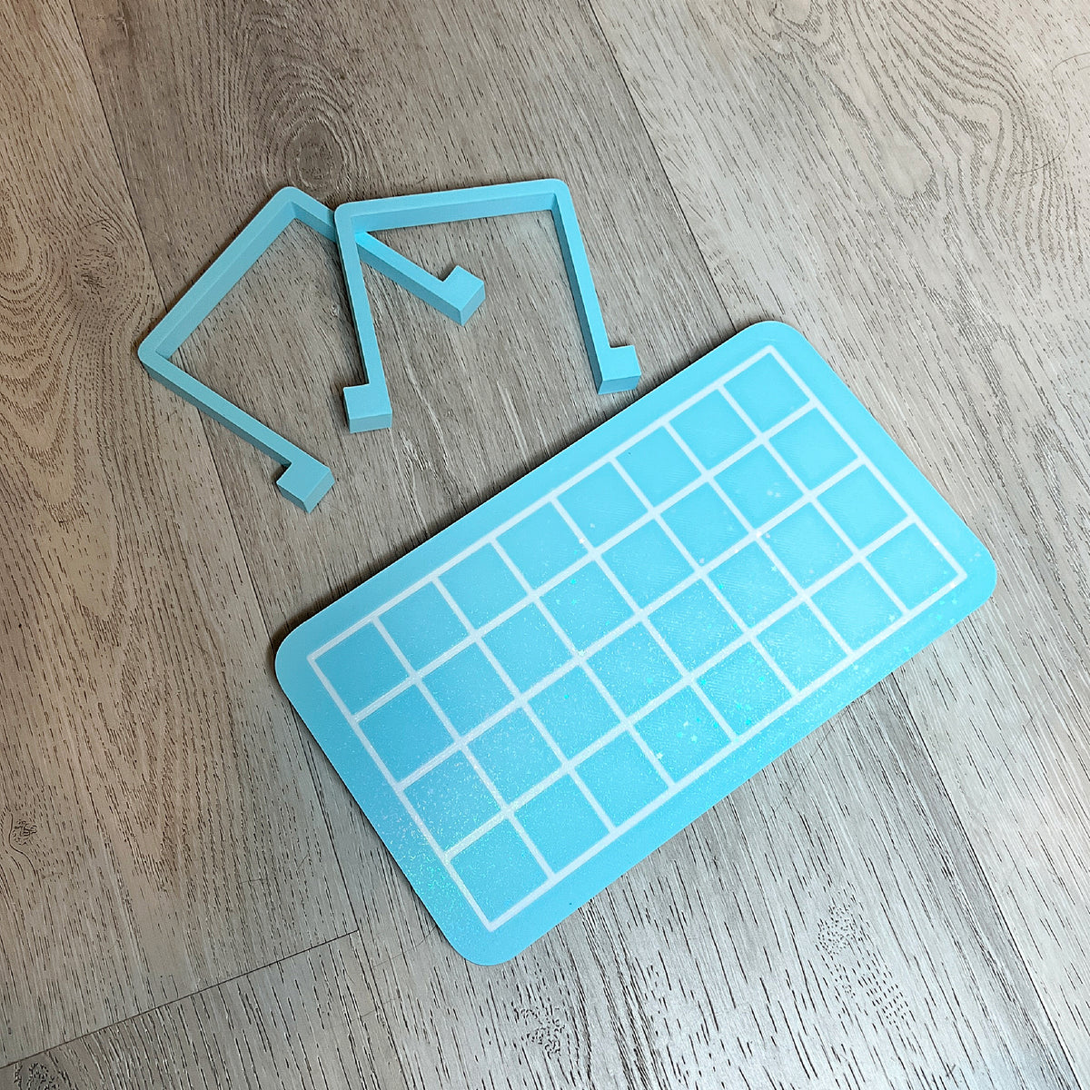 Gridded heat sealer table for cello bags, designed by Kiburz Cookies