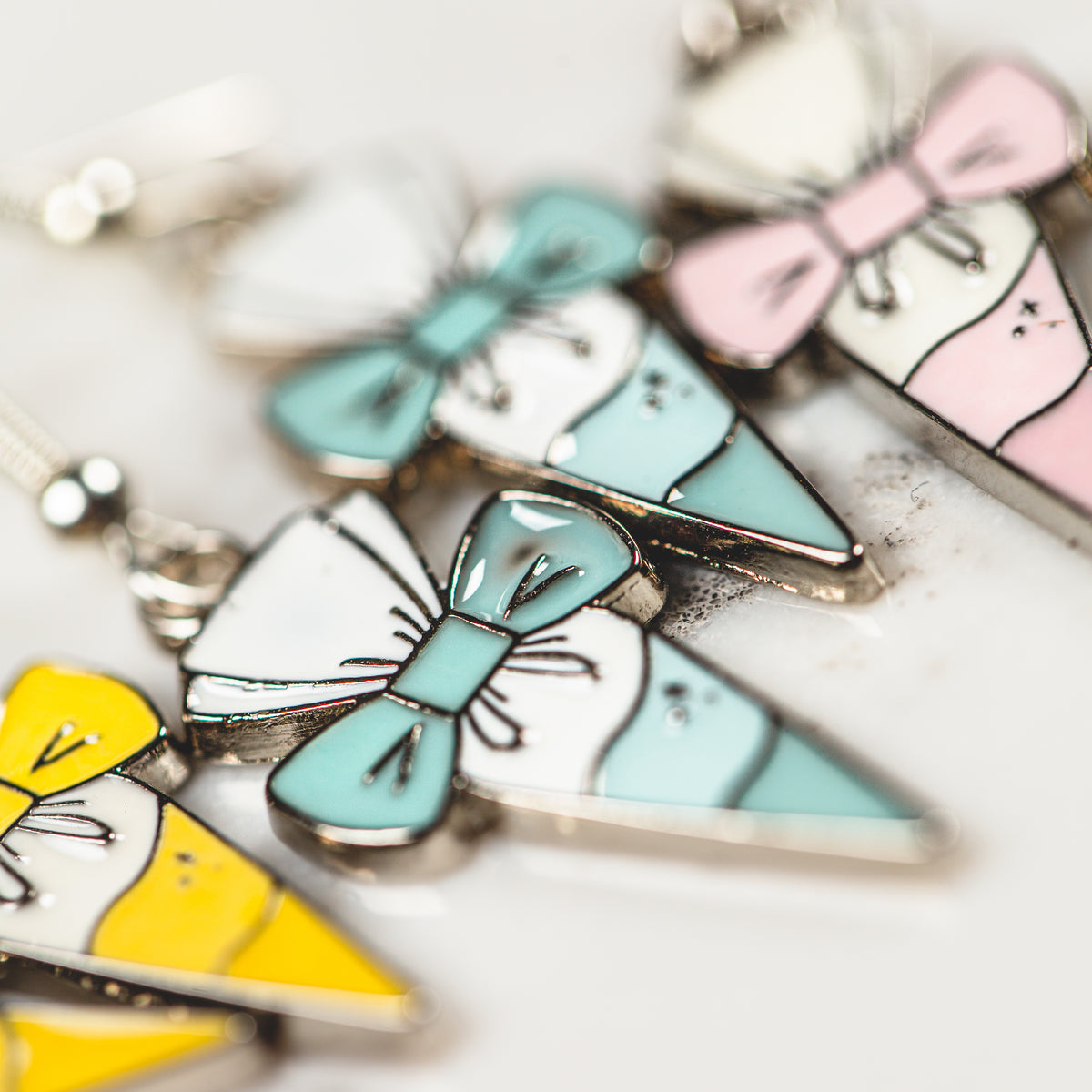 Dainty piping bag and bow clip enamel charm earrings