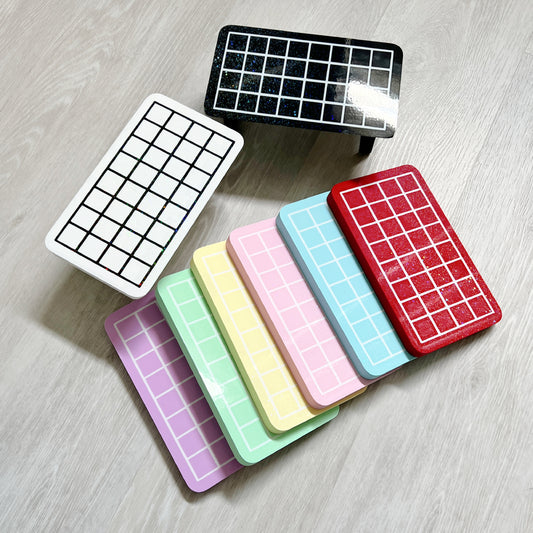 Gridded heat sealer table for cello bags, designed by Kiburz Cookies