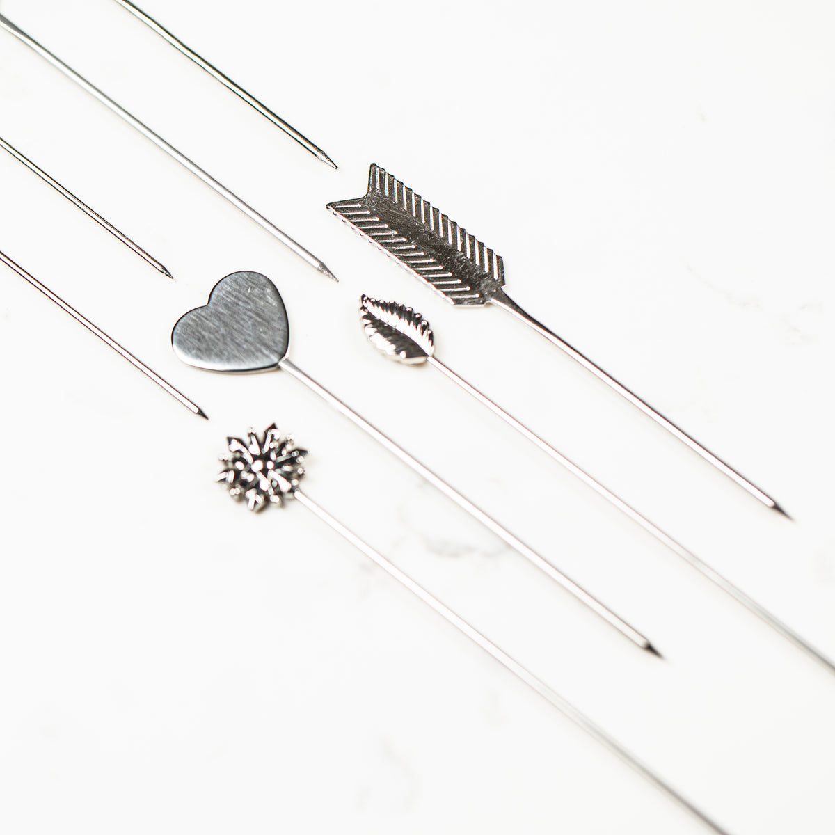 Naked stainless steel cookie scribe, snowflake and leaf needle design
