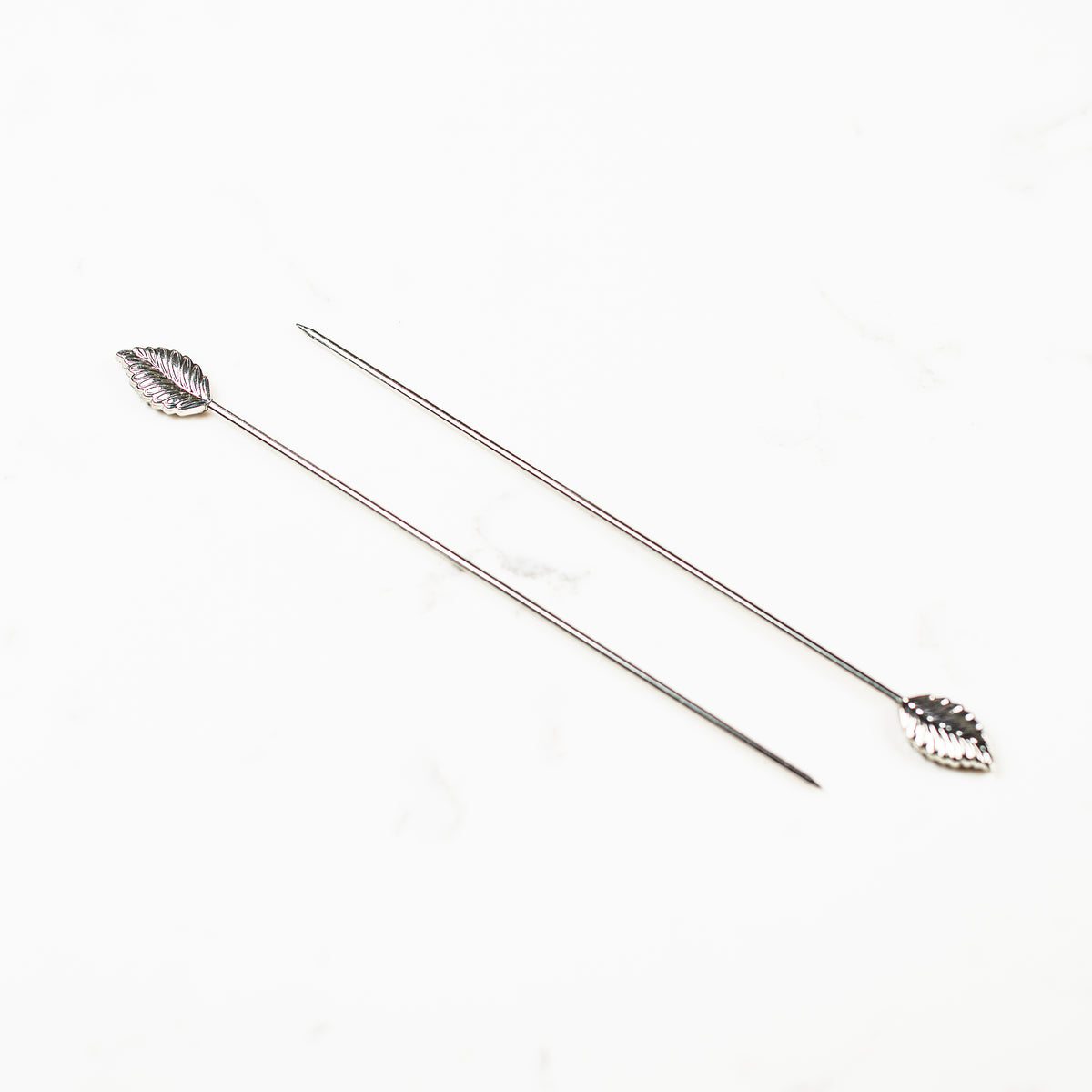 Naked stainless steel cookie scribe, snowflake and leaf needle design