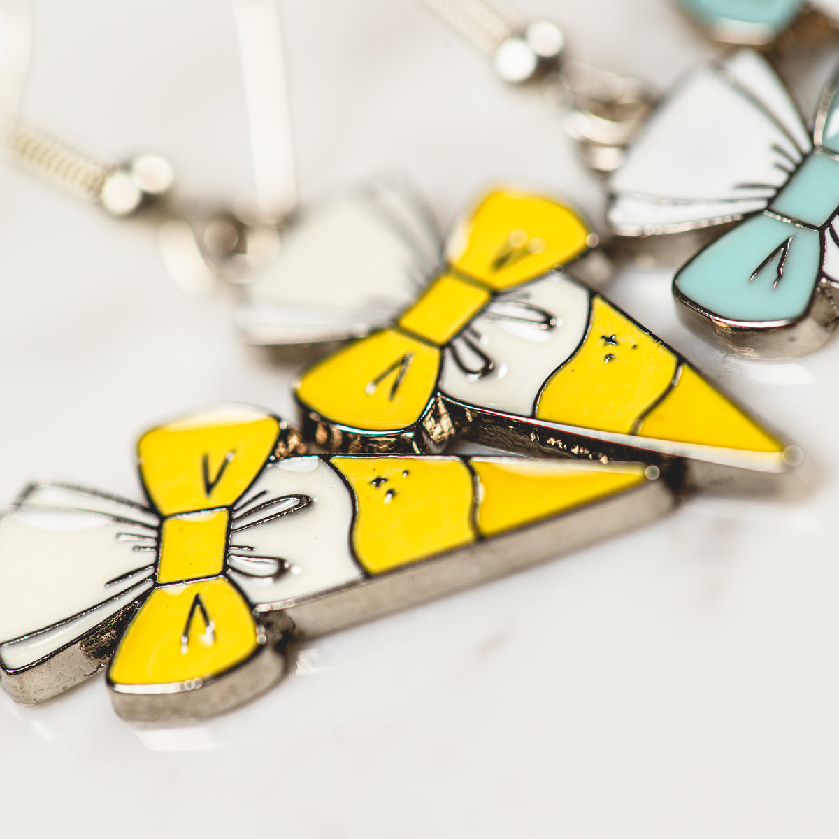 Dainty piping bag and bow clip enamel charm earrings