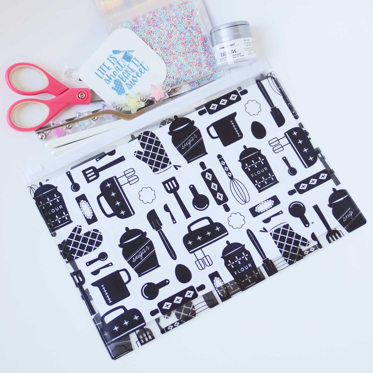 Black and white slide-close storage pouch for cookie decorating tools